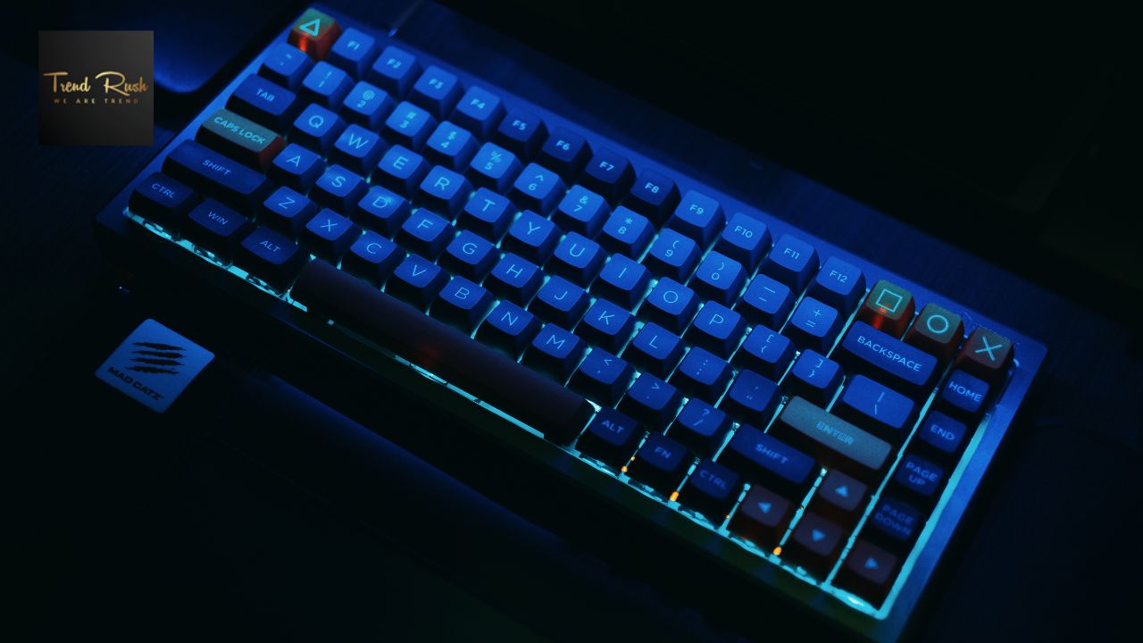 A low latency keyboard shown with blue light and on the upper left corner shown trendrush.org logo